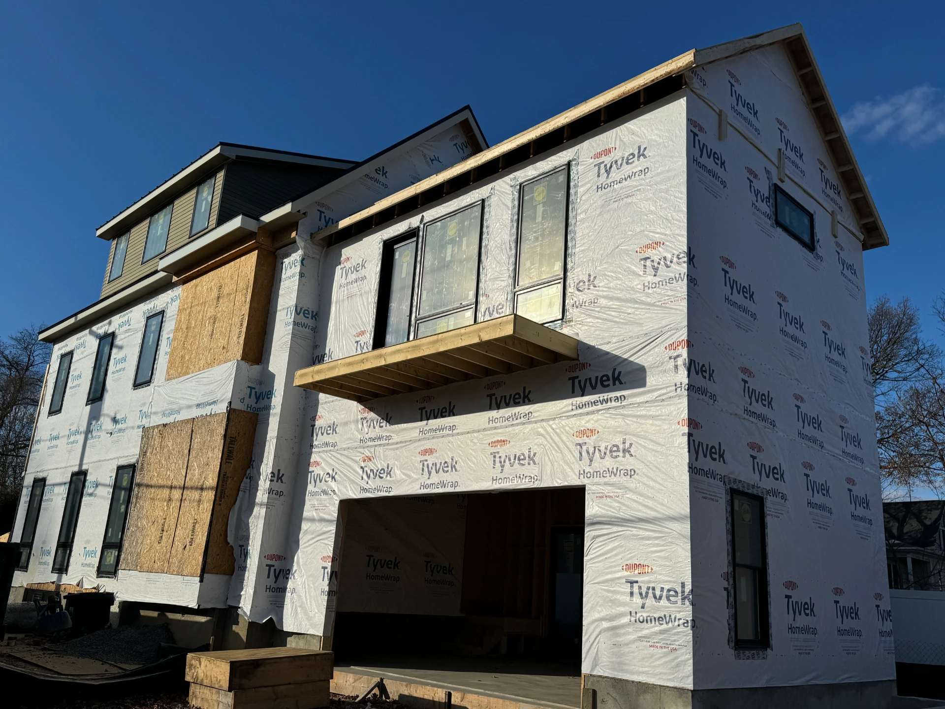 Image of 2-story home construction project in progress by Brother's Best Construction illustrating the company as Custom home Builders Arlington VA